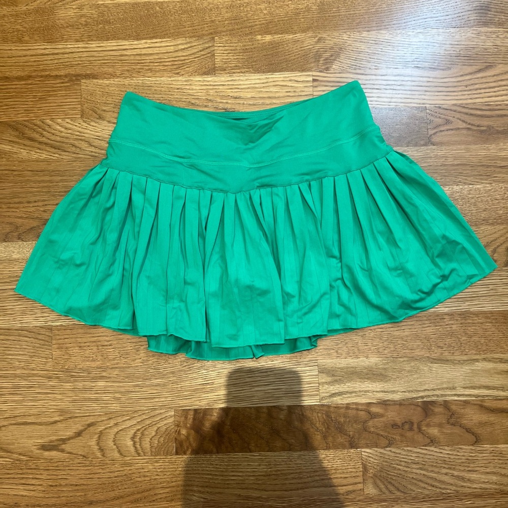 Green pleated tennis skirt